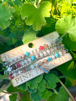 Colorful and gold bead charm bracelet stack